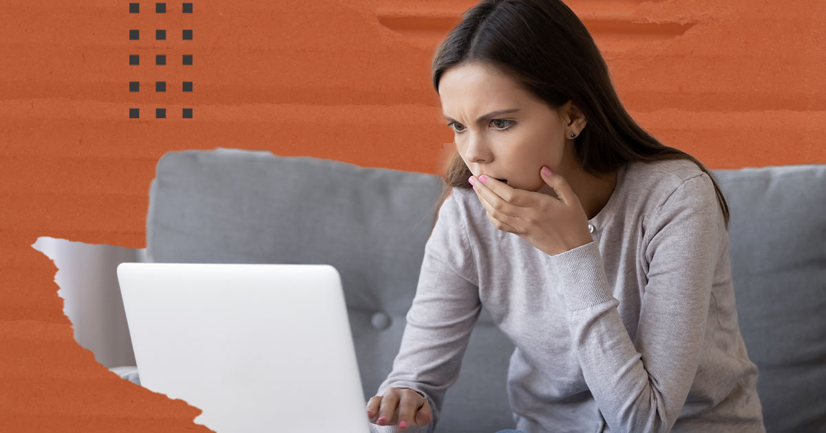 A woman looks frustrating while using a website with poor UX design